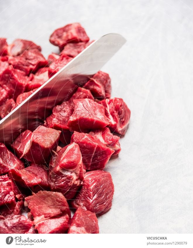 Cut meat into cubes for goulash Food Meat Nutrition Lunch Dinner Organic produce Diet Knives Style Design Healthy Eating Table Kitchen Gourmet Protein