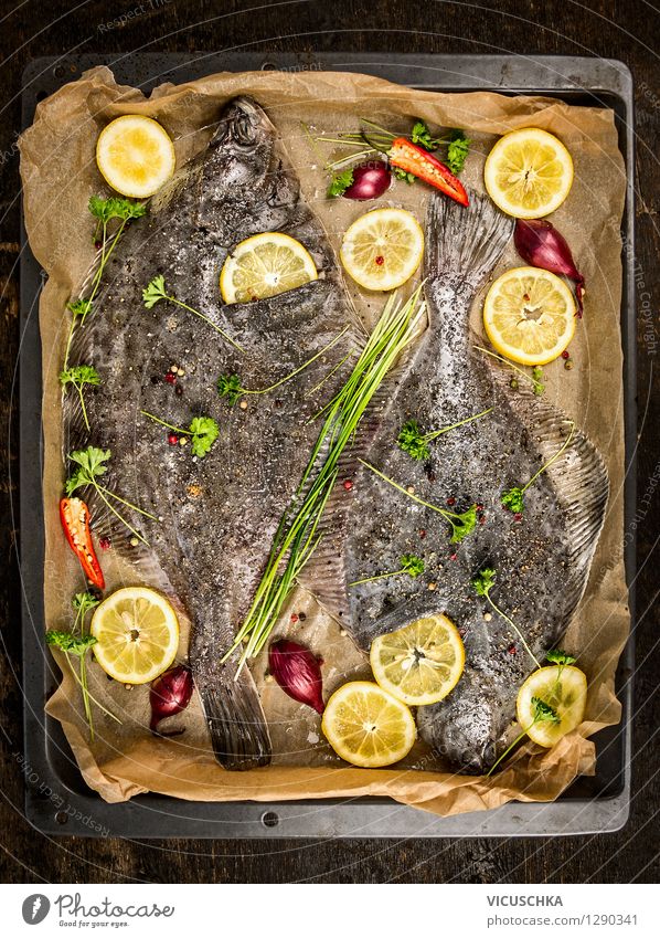 Plaice fish with lemon slices on the baking tray Food Fish Vegetable Herbs and spices Cooking oil Nutrition Lunch Dinner Organic produce Vegetarian diet Diet