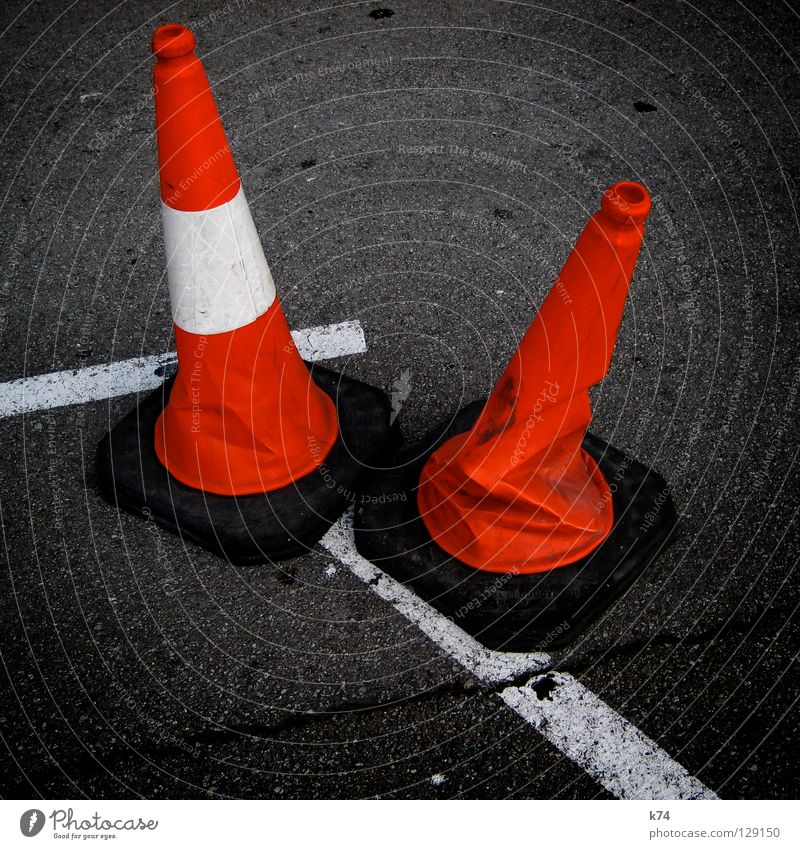 TWO HATS. Hat Construction site Barrier Barred Bans Red White Asphalt Tar Traffic lane Together Equal Difference Wrinkles Accident Collateralization Safety