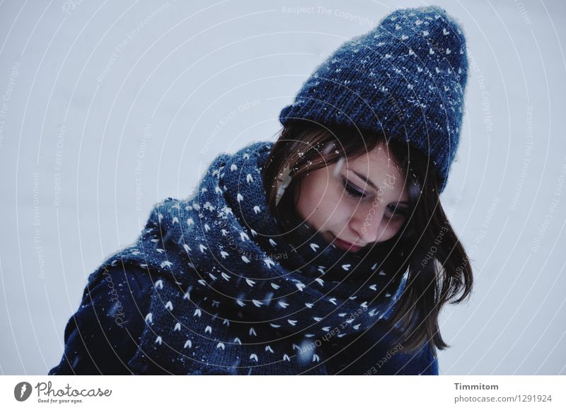 In thought. Human being Young woman Youth (Young adults) Head 1 Winter Snow Snowfall Clothing Scarf Cap Hair and hairstyles Blue Gray White Emotions Contentment