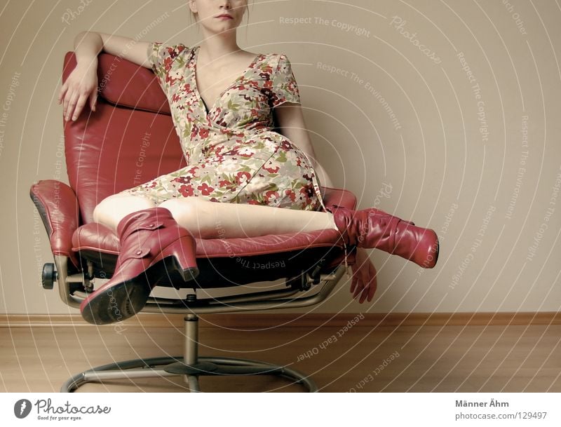 Sit-in. Posture Woman Armchair Leather Footwear Flower Dress Clothing Boots Red Multicoloured Furniture Slouch Crouch Thigh Lower leg Get stuck Tights Nylon