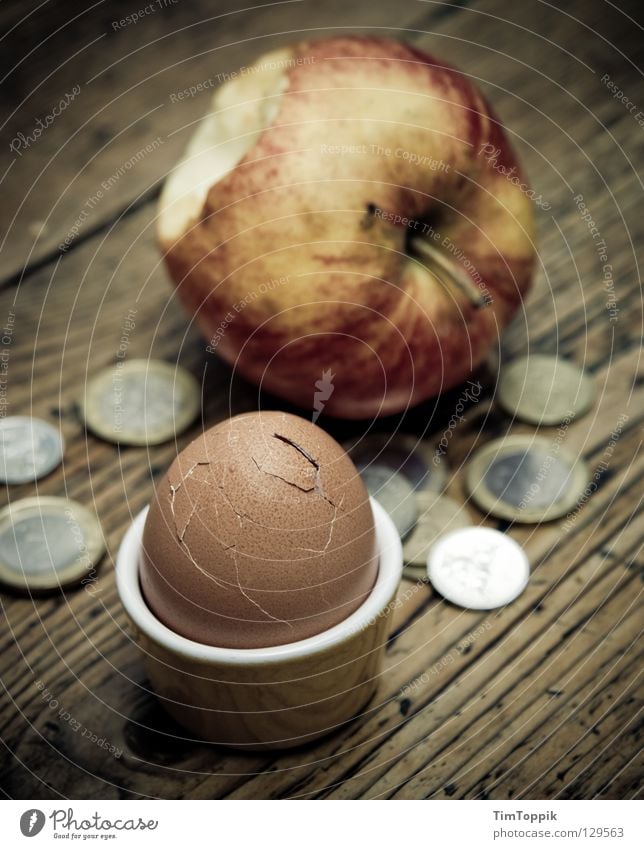 For an appeal and an egg! Egg cup Eggshell Money Coin Paying Poverty Cheap Apple skin Table Wood Tabletop Breakfast Nutrition Crack & Rip & Tear Euro Bite