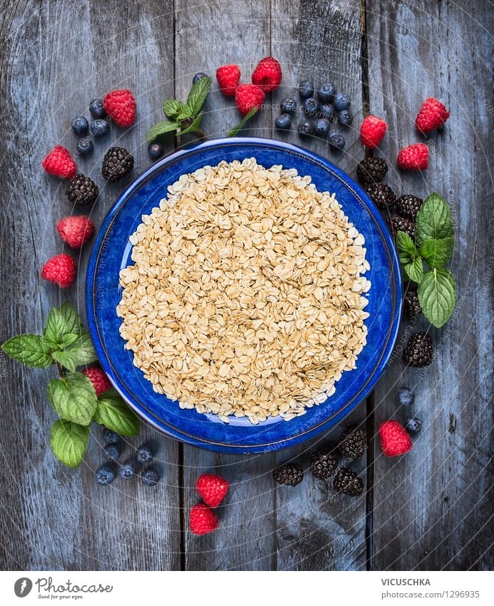 Oat flakes in blue bowl with berries Food Fruit Grain Nutrition Breakfast Organic produce Vegetarian diet Diet Plate Bowl Style Design Healthy Eating Life