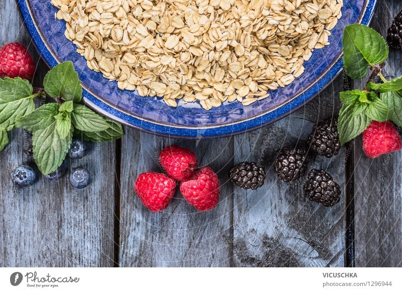 Oat flakes in blue bowl with berries Food Fruit Grain Nutrition Breakfast Organic produce Vegetarian diet Diet Plate Bowl Style Design Healthy Eating Life Table