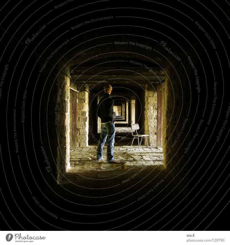 [i_] Fellow Man Masculine Posture Stand Dark Cellar Deep Light Far-off places Wall (barrier) Wall (building) Decline Historic Pattern Black Yellow Square