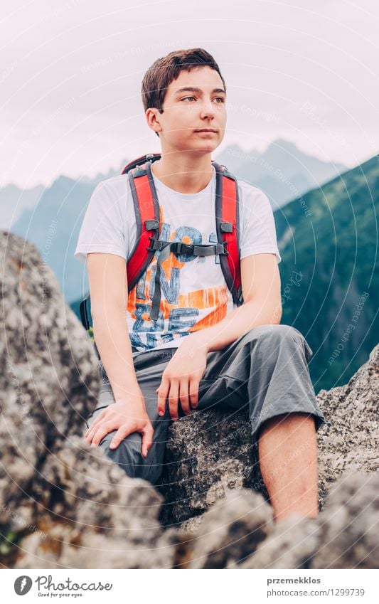 Boy sitting on the rock in the mountains Vacation & Travel Adventure Summer Mountain Hiking Child Boy (child) 1 Human being 13 - 18 years Youth (Young adults)