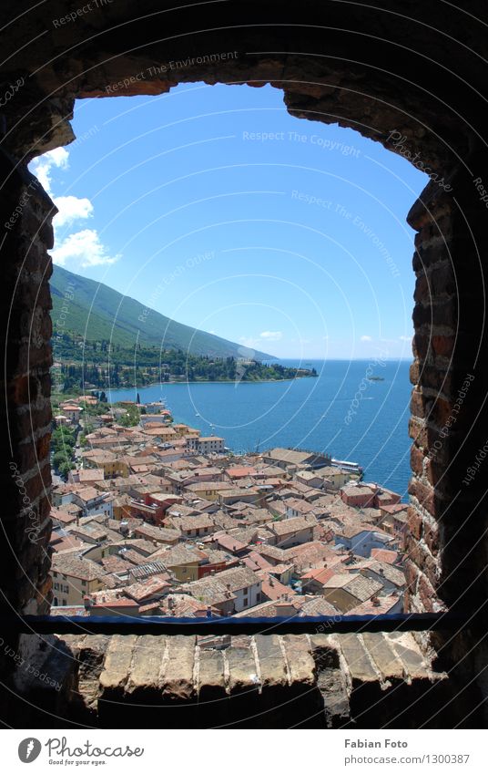 View outside Vacation & Travel Far-off places Freedom Summer Ocean Mountain Water Horizon Coast Lakeside Bay Castle Ruin Window Stone Brick Historic Tall Cold