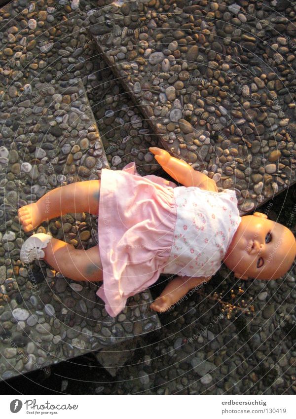 Lost childhood Infancy Dress Toys Doll Old Sadness Broken Grief Innocent Transience Time Baby doll Stone slab Doomed Past Former Search Colour photo Lie