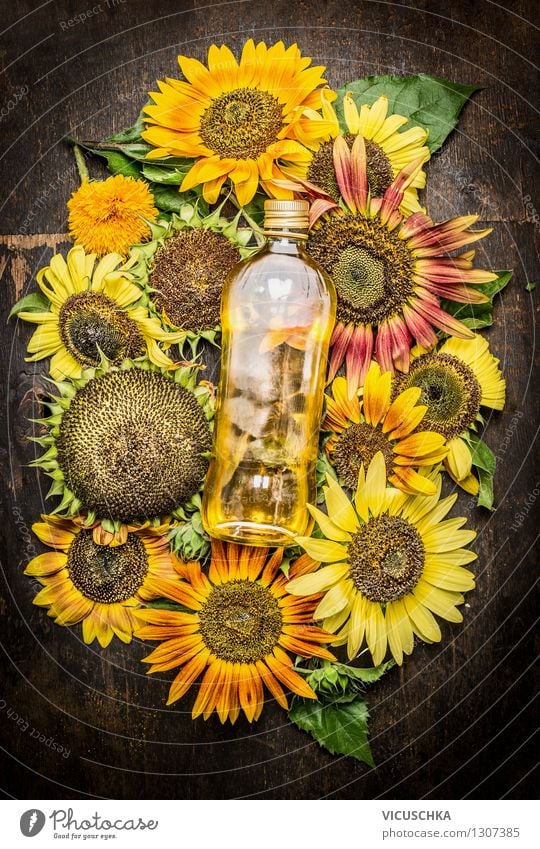 Sunflower oil with colourful sunflowers Food Cooking oil Nutrition Organic produce Vegetarian diet Diet Bottle Glass Summer Nature Flower Agricultural crop