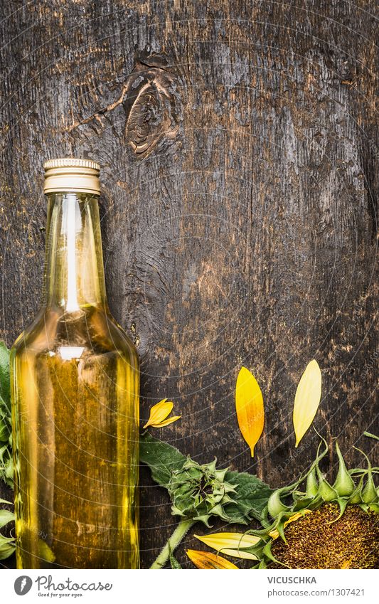 Bottle of sunflower oil on rustic wooden table Cooking oil Nutrition Organic produce Vegetarian diet Diet Style Design Healthy Eating Life Summer Table Nature