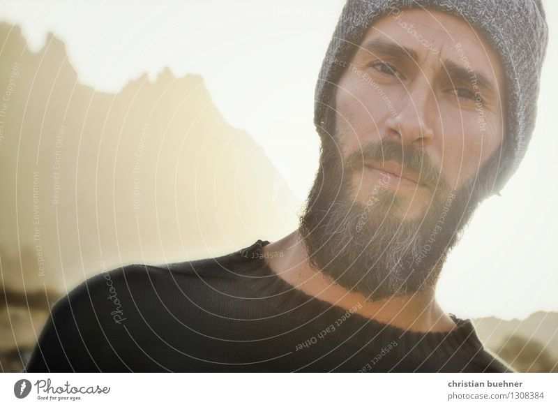 Portrait of a man in the sunset with beard Man Adults Face 1 Human being 30 - 45 years Nature Mountain Cap Beard Think Looking Sharp-edged Self-confident