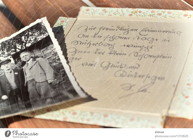 old paper picture lies on a piece of paper handwritten in old German Photography Cardboard Novel Novella Front page Past Old Historic Uniqueness Romance