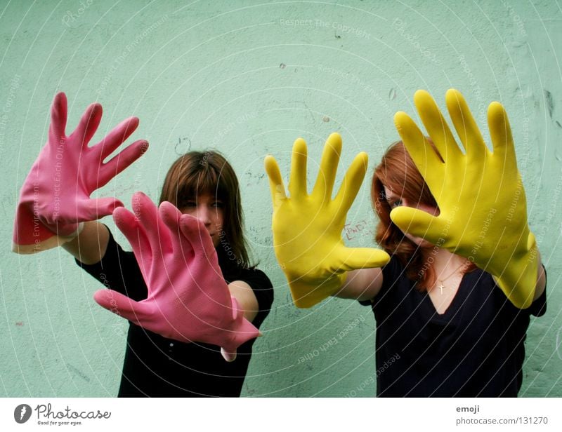 two women with gloves Gloves Rubber Pink Yellow Gaudy Intoxicant Turquoise Wall (building) Hand Dirty Cleaning Noble Whimsical Strange Carnival Obscure Fingers