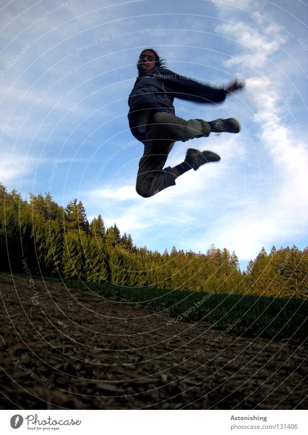 in the sky Man Forest Field Meadow Jump Light Clouds Tree Air Action Joy Sky Human being Nature Legs Arm Shadow Sun Floor covering Level Contrast