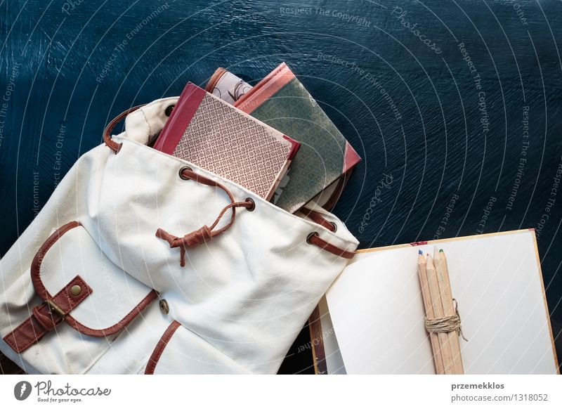 Notebooks pencils and school bag on a desktop Table Education School Study Book Accessory Backpack Crayon notebook Pencil Colour photo Interior shot Close-up