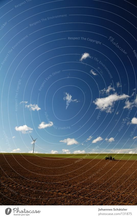 The farmer and the field Field Grass Agriculture Farmer Wind energy plant Science & Research Electricity Power Clouds Sky Spring Summer Sowing Tractor Cow dung