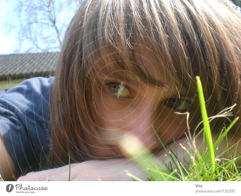 reckless of danger Woman Grass Thought Physics Think Empty Youth (Young adults) Face Lawn Looking Warmth Expressionless Graffiti Lie Snapshot Exterior shot