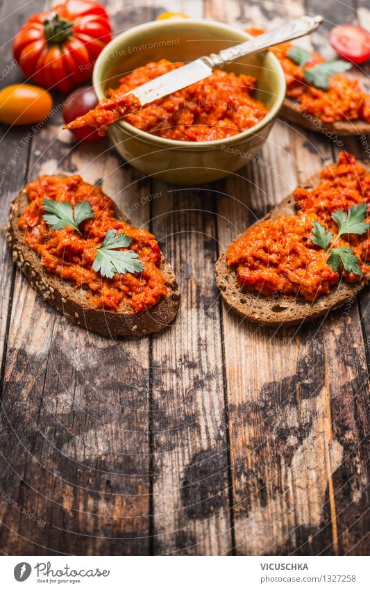 Cutlets with tomatoes paprika spread. Food Vegetable Bread Nutrition Lunch Organic produce Vegetarian diet Diet Bowl Knives Lifestyle Style Design