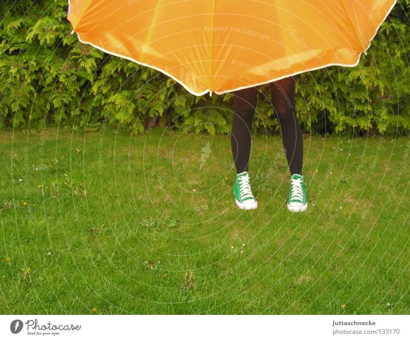 The woman without upper body Sunshade Umbrella Green Meadow Grass Agent Summer Garden Park Legs Pantyhose Pantyhose Sneakers Orange Lawn Protection Hide