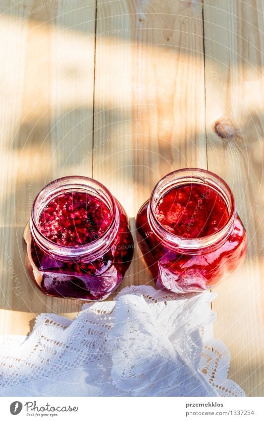 Homemade jam on wooden table Fruit Jam Breakfast Spoon Summer Table Nature Fresh Delicious Natural Red Tradition food glass healthy Home-made Ingredients jar