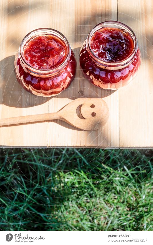 Homemade jam on wooden table Fruit Jam Breakfast Spoon Summer Table Nature Grass Fresh Delicious Natural Red Tradition food glass healthy Home-made Ingredients