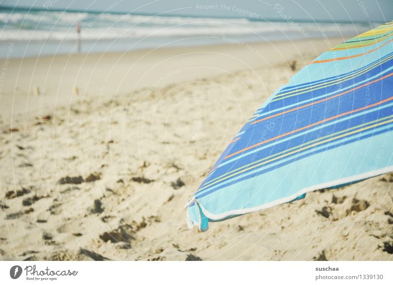 sun + umbrella = parasol Sunshade Sand Beach Ocean Water Waves Cloth Striped vacation holidays Summer Relaxation