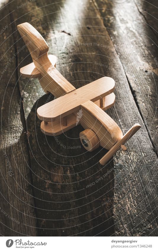 Vintage wooden plane on wooden board Vacation & Travel Craft (trade) Air Transport Airplane Aircraft Toys Old Small Retro Tradition vintage Model handmade fly
