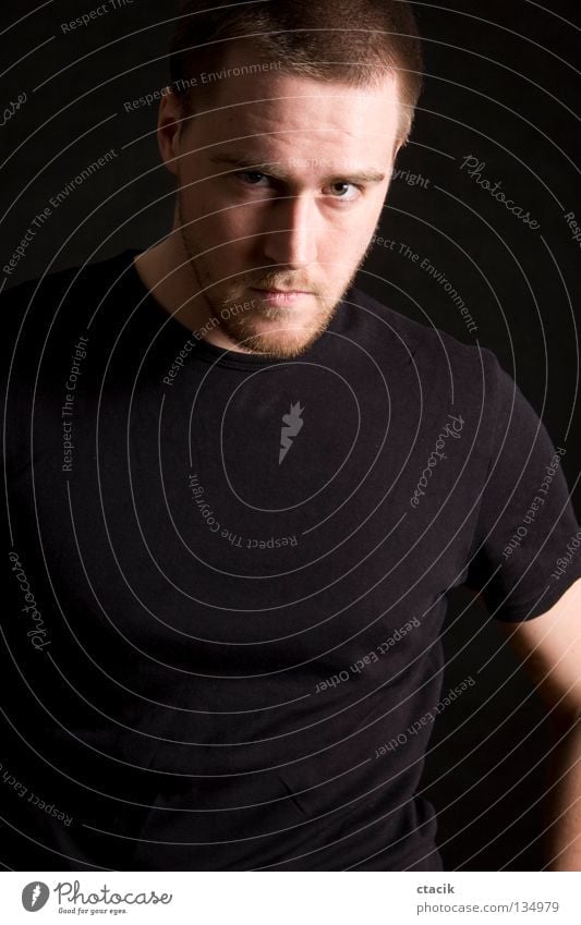 young man portrait Human being Portrait photograph Posture Man Masculine Partially visible Section of image Looking into the camera T-shirt Dark background