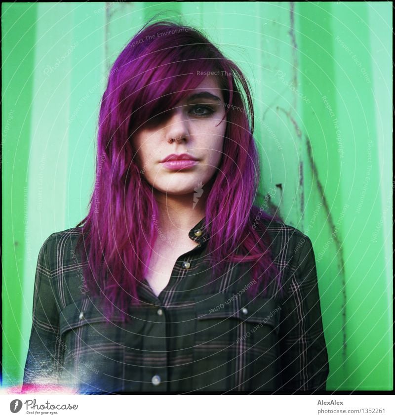 analog rectangular portrait of young woman with purple hair in front of green steel sheet wall - with lightleaks Container Tin Green Violet Young woman