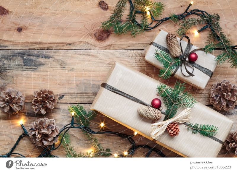 Wrapped Christmas presents on wooden floor Paper Package Box Wood Tradition Guest December Story Gift Home Horizontal Pine Rustic Seasons Colour photo