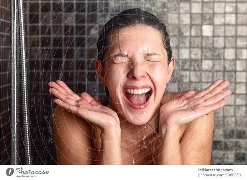 Young woman reacting in shock under shower Lifestyle Joy Beautiful Personal hygiene Body Hair and hairstyles Skin Face Healthy Wellness Well-being Bathroom