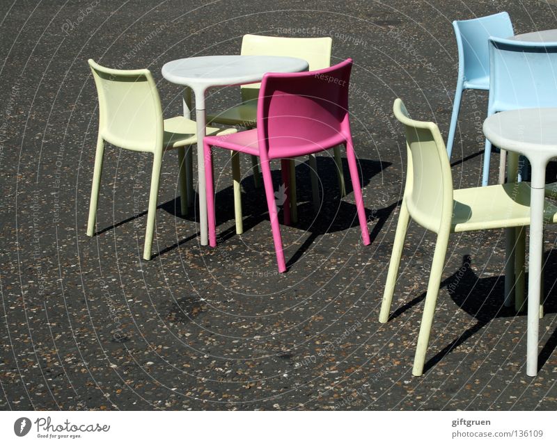 embarras de richesses Selection Chair Empty Loneliness Offset Multicoloured Sidewalk café Café Pink Cyan Yellow Table Summer Asphalt Gastronomy Furniture