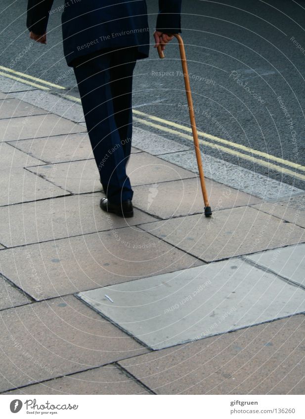 the long walk Man Stick To go for a walk Going Slowly Town Suit Senior citizen Traffic infrastructure Loneliness Street