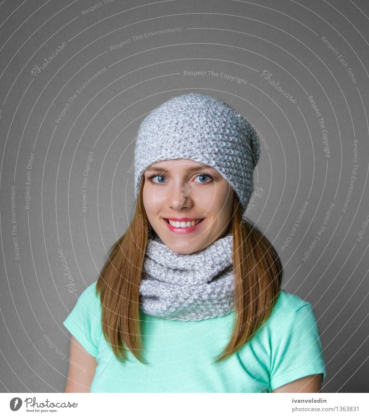 Smiling young girl in winter cap and scarf Joy Happy Beautiful Skin Face Cosmetics Winter Human being Girl Woman Adults Warmth Fashion Clothing Sweater Scarf