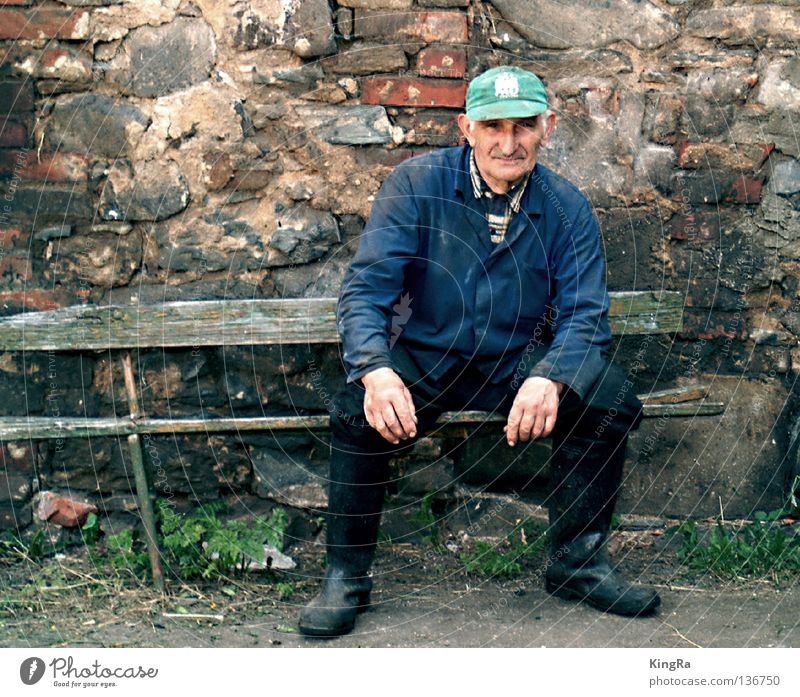The last big farmer Wall (barrier) Portrait photograph Derelict Brick Man Farmer Bench Old Tilt