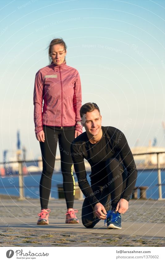 Couple in Fitness Attire Ready for Outdoor Workout Lifestyle Sports Sports Training Jogging Work and employment Human being Masculine Feminine Woman Adults Man