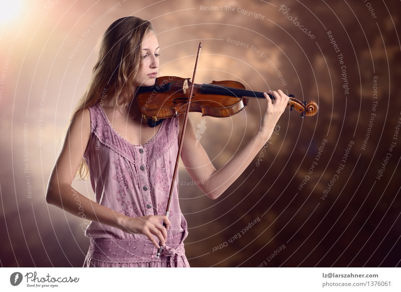 Pretty young violinist playing the violin Playing Music Academic studies Girl Woman Adults Youth (Young adults) Art Culture Concert Musician Violin artist bow