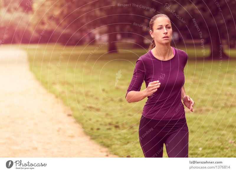 Athletic Woman in Running Exercise at the Park Summer Sports Jogging Adults Nature Determination Action athlete athletic cardio Copy Space Practice healthy