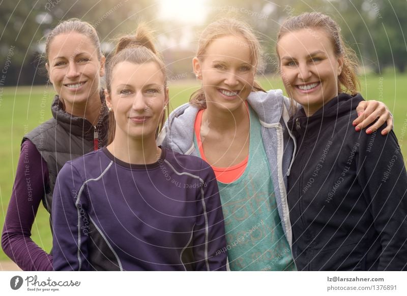 Four Healthy Women after outdoor exercise Happy Face Success Woman Adults Friendship Park Lanes & trails Fitness Smiling Athletic Thin 20s Action at camera