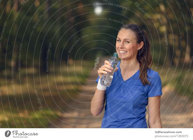 Fit young woman drinking bottled water Beverage Drinking Lifestyle Happy Body Face Wellness Summer Sports Girl Woman Adults 1 Human being 13 - 18 years