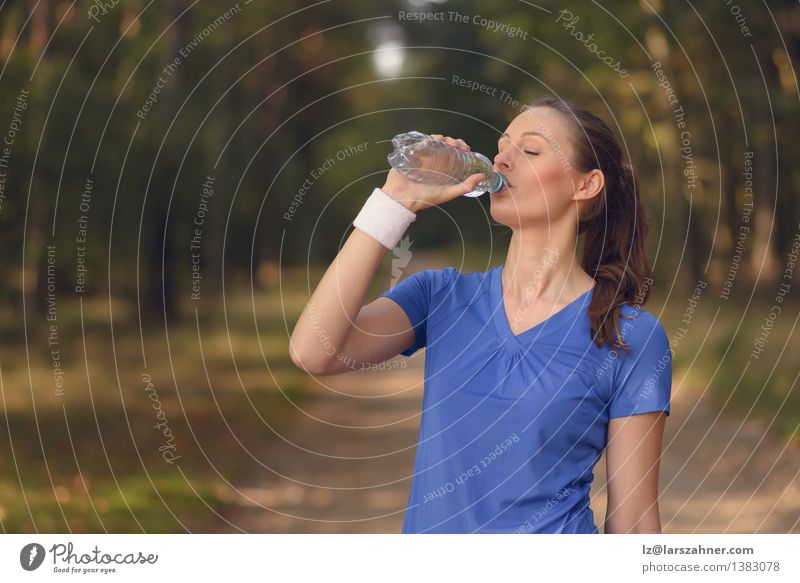 Fit young woman drinking bottled water Beverage Drinking Lifestyle Happy Body Face Wellness Summer Sports Girl Woman Adults 1 Human being 13 - 18 years