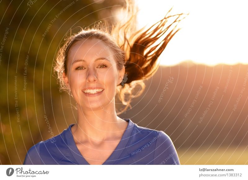 Attractive woman out exercising in glowing light Lifestyle Happy Beautiful Face Wellness Summer Sports Girl Woman Adults Teeth 1 Human being 18 - 30 years