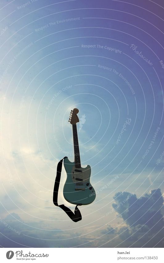 air guitar Far-off places Freedom Music Guitar Air Sky Clouds Flying Throw Blue Violet Electric guitar Musical instrument string Rock'n'Roll Song Tone