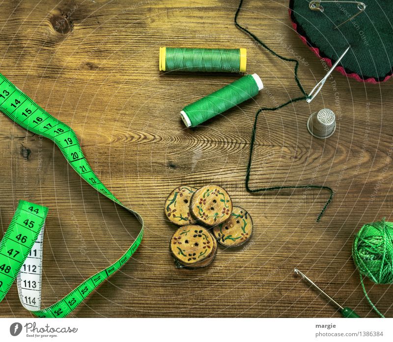 Threaded green: Sewing equipment, such as needle, tape measure, buttons, thread, thimble wool and a crochet hook Leisure and hobbies Profession Tailor Tailoring
