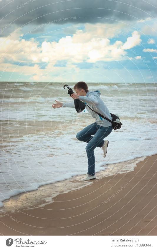 boy jumping at the Sea. Young man Youth (Young adults) Body 1 Human being 18 - 30 years Adults Nature Landscape Sky Clouds Sun Summer Beautiful weather Storm