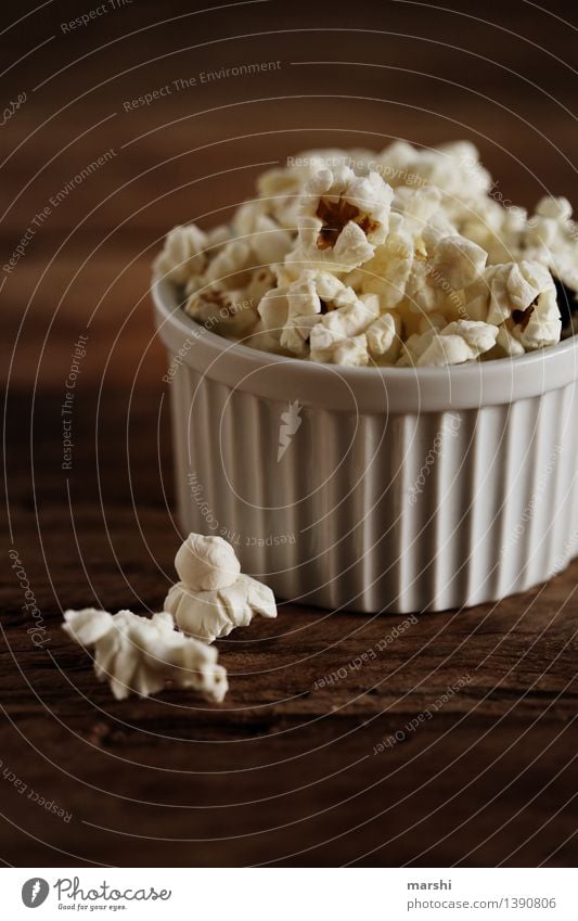 Popcorn to go Food Dessert Candy Nutrition Eating Moody Maize puffed Bowl Dark Snack Cinema Delicious Sweet Salty Sugar Colour photo Interior shot Studio shot