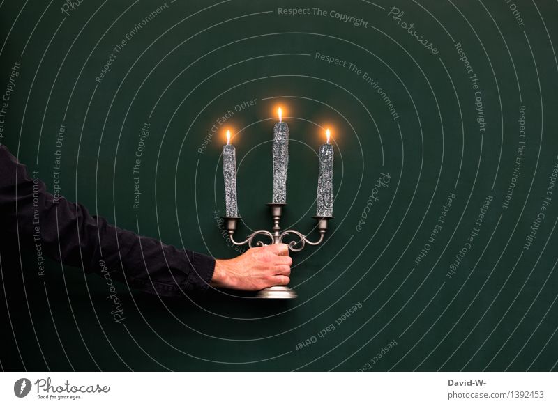 Creativity - a man holding a candlestick made of self-painted candles Man by hand Candle holder Illuminate Burn creatively Drawing enlightenment conceit somber