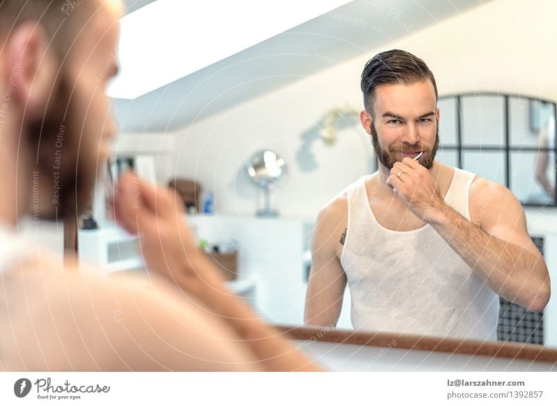 Bearded man brushing teeth in bathroom Face Health care Mirror Bathroom Man Adults Teeth Toothbrush Modern Clean caries cleaning cleanliness Dental Dentistry