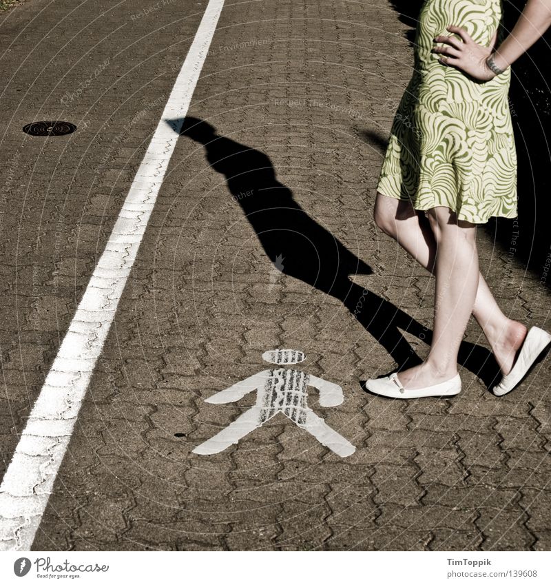 Women in power Pedestrian Woman Footwear Dress Summer dress Sidewalk Symbols and metaphors Header Stand Knee Hand Shadow Urban traffic regulations Street sign