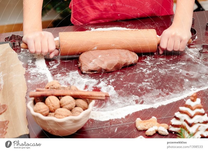 Girl making dough for a Christmas cookies Table Kitchen Human being Hand 1 8 - 13 years Child Infancy Make Flour Gingerbread Home-made knead Preparation